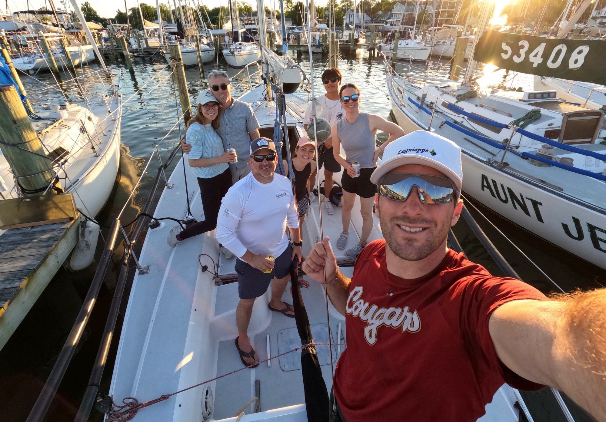 Crew Connect sailors aboard a boat at the dock at sunset in Annapolis.